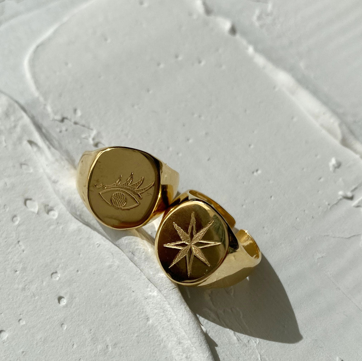 Anillos de familia dorados grandes estrella y ojo